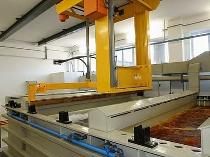 Automated 600Kg carrier on Anodising plant showing  tanks with lip extraction 