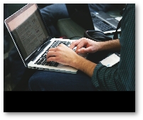 Thumbnail image typing on laptop keyboard